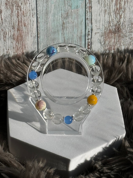 7 1/2" Clear with a touch of Blue/Yellow/Cream/Teal/Blue Glass Beaded Bracelet (10mm)